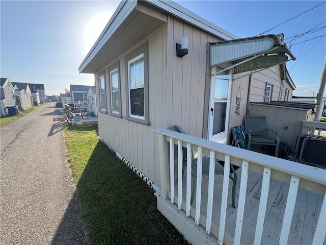 view of home's exterior with a yard