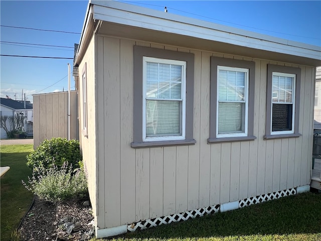 view of side of property with a yard