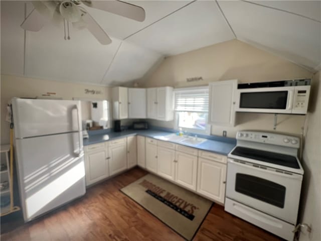 kitchen featuring vaulted ceiling, white cabinets, dark hardwood / wood-style flooring, white appliances, and ceiling fan