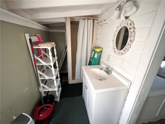 laundry room with carpet floors and sink