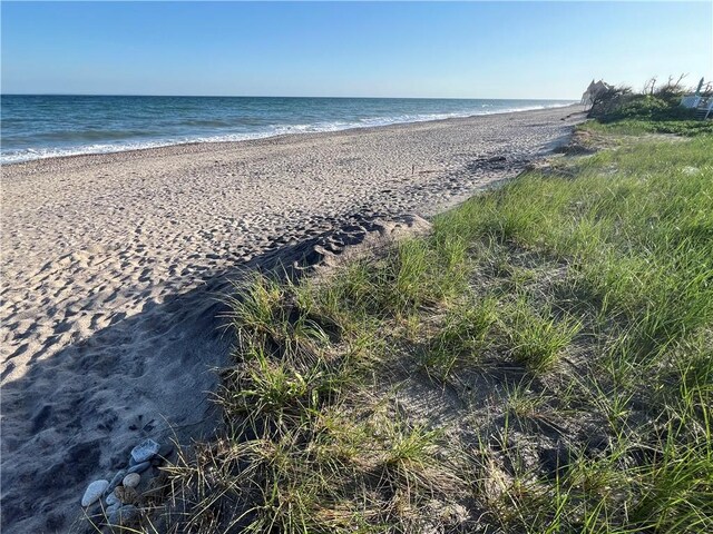 property view of water featuring a beach view