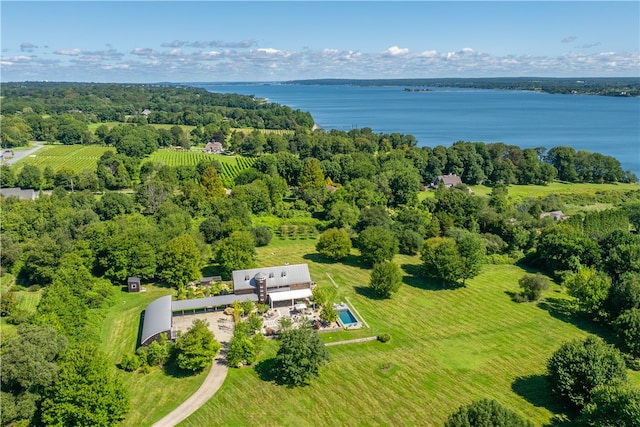 birds eye view of property with a water view