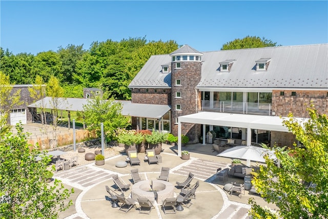 rear view of house featuring a patio area