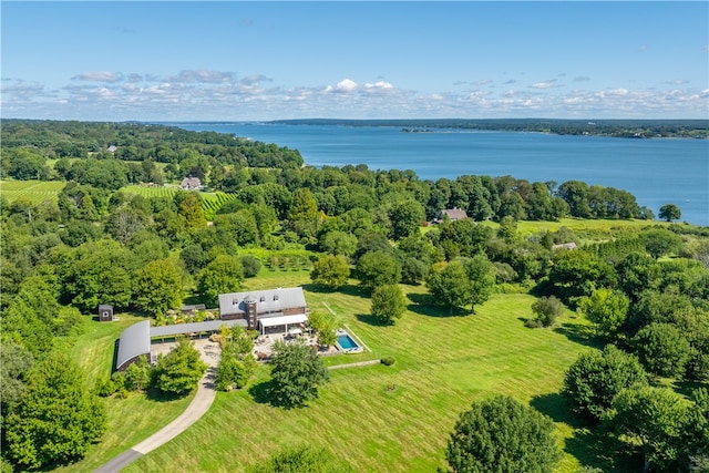 birds eye view of property with a water view