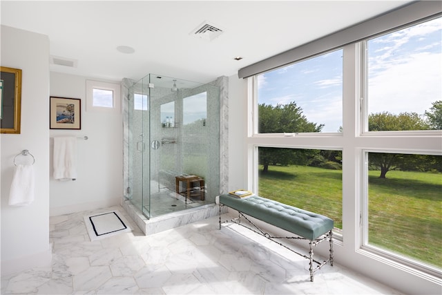 bathroom with walk in shower and tile patterned flooring