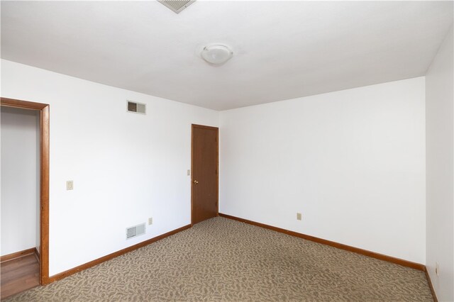 empty room featuring carpet flooring