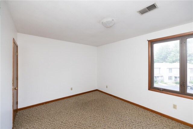 unfurnished room featuring carpet flooring