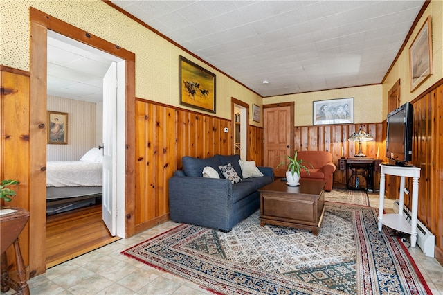 tiled living room with crown molding and wooden walls