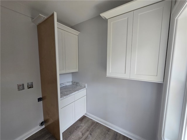 laundry room featuring cabinets, dark hardwood / wood-style floors, and washer hookup