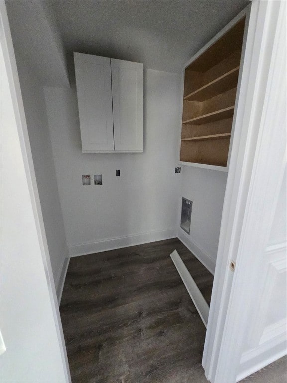 clothes washing area featuring washer hookup, dark wood-type flooring, hookup for an electric dryer, cabinets, and a textured ceiling