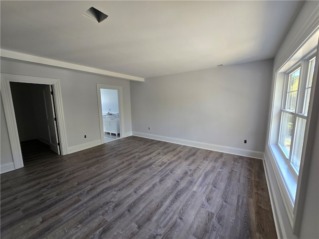 empty room featuring dark hardwood / wood-style flooring