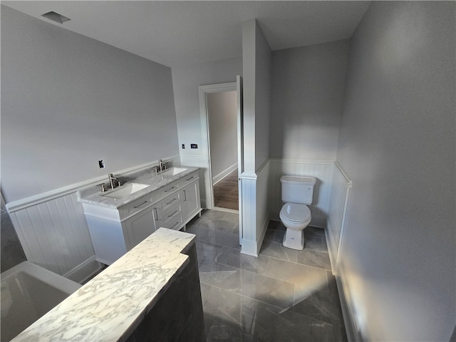 bathroom with vanity and toilet