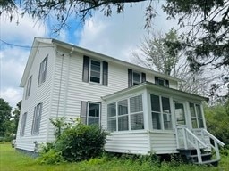 rear view of house with a sunroom