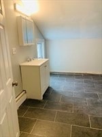 bathroom featuring vanity, a baseboard radiator, and tile patterned floors