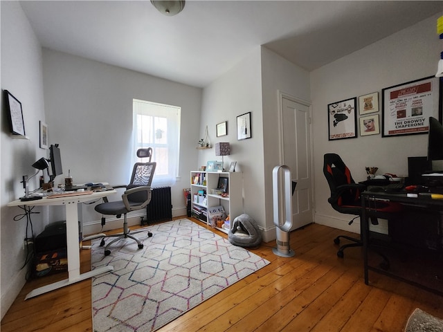 office area with light hardwood / wood-style flooring