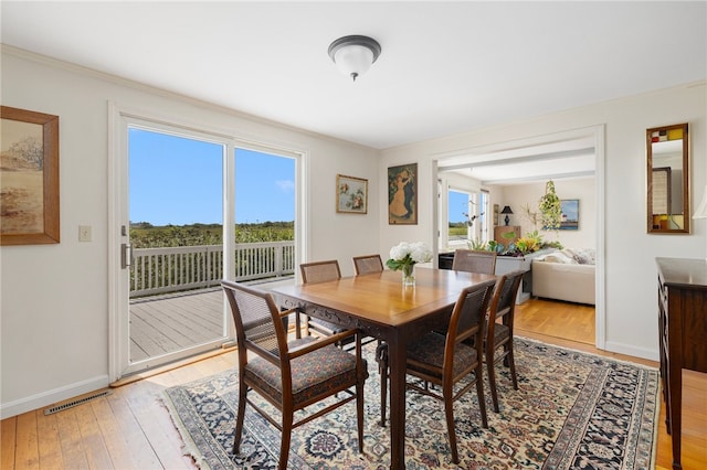 dining space featuring hardwood / wood-style floors