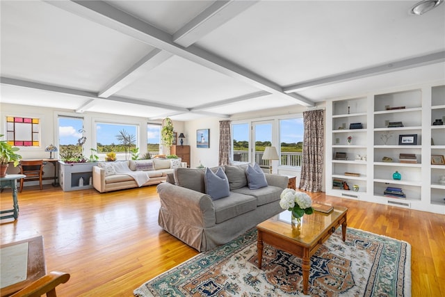 living room with beamed ceiling and light hardwood / wood-style flooring