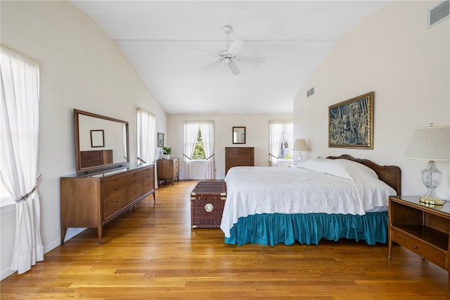 bedroom with lofted ceiling, ceiling fan, and wood-type flooring