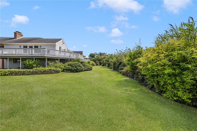 view of yard featuring a wooden deck