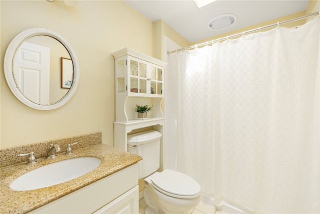 bathroom with tile patterned flooring, vanity, toilet, and a shower with curtain