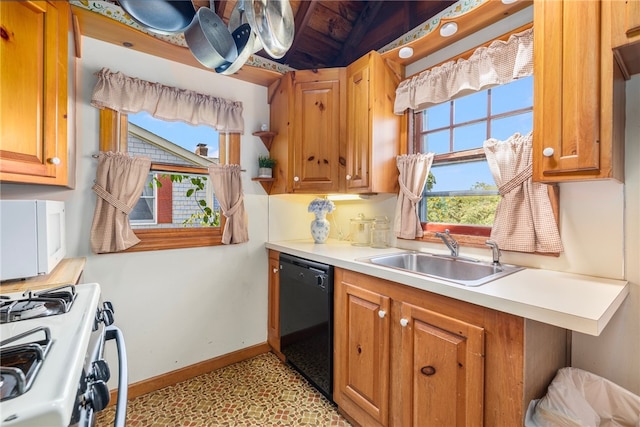 kitchen featuring sink, light tile patterned floors, and white appliances