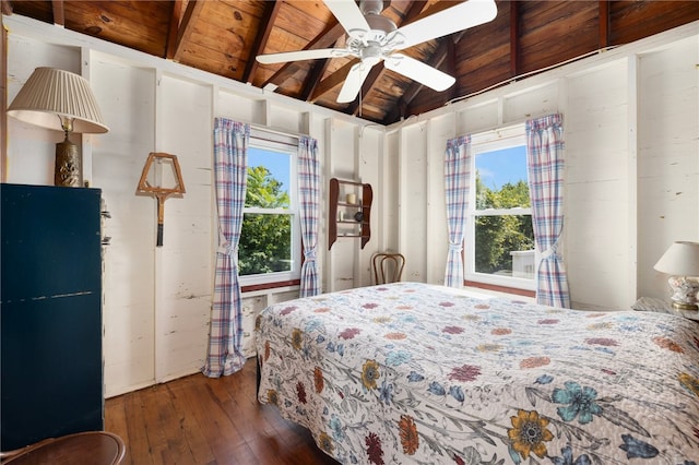 bedroom with wood ceiling, dark hardwood / wood-style flooring, ceiling fan, and vaulted ceiling with beams