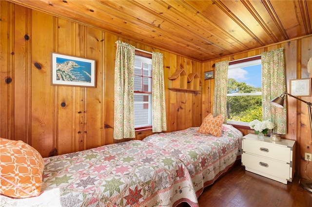 bedroom with wood walls, wood ceiling, and dark hardwood / wood-style floors