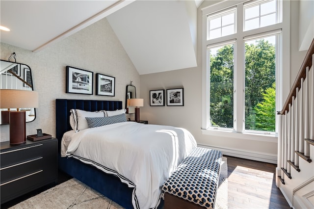 bedroom with high vaulted ceiling and hardwood / wood-style flooring