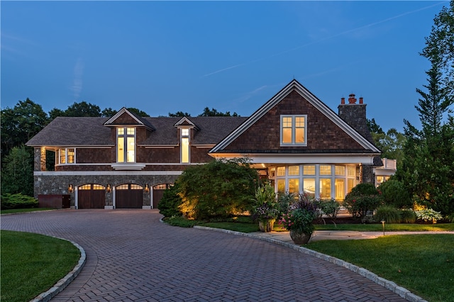 craftsman-style home featuring a front lawn