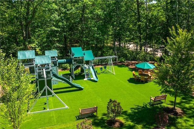 exterior space featuring a playground and a yard