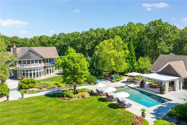 view of swimming pool with a patio area, a yard, and a gazebo