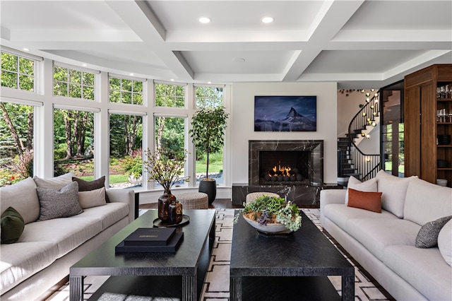 sunroom / solarium with coffered ceiling, beam ceiling, and a high end fireplace