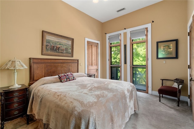 carpeted bedroom with access to outside