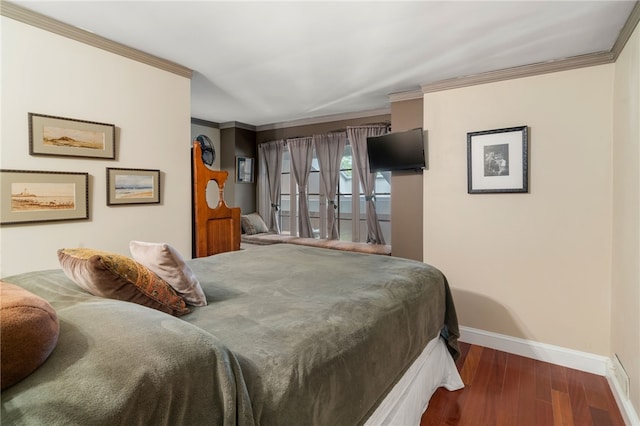 bedroom with dark hardwood / wood-style floors and crown molding