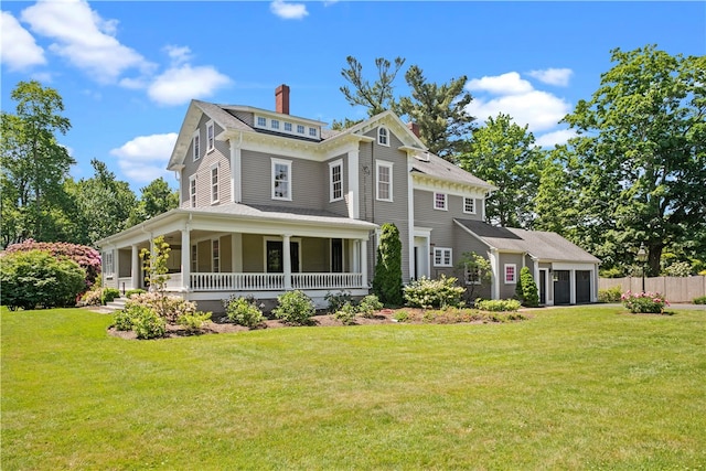 back of house featuring a porch and a lawn