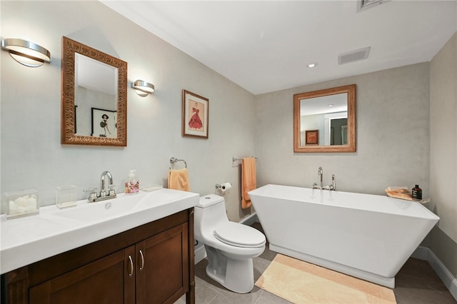 bathroom with a bathtub, tile patterned floors, toilet, and vanity