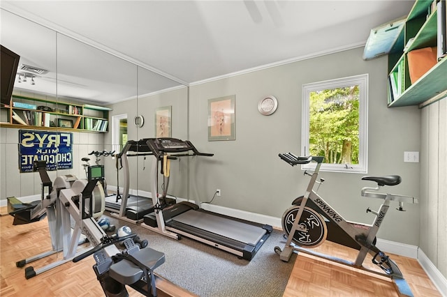 workout room with ornamental molding and parquet floors