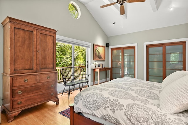 bedroom with access to exterior, light hardwood / wood-style floors, high vaulted ceiling, and ceiling fan