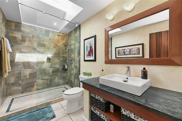 bathroom featuring walk in shower, vanity, toilet, and tile patterned floors