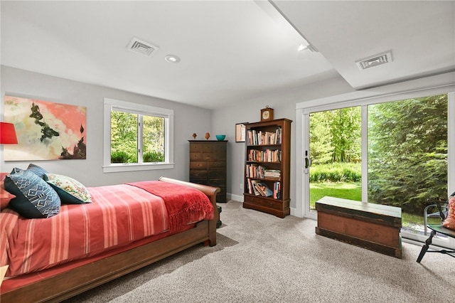 bedroom featuring light carpet