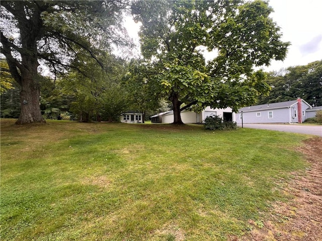 505 Central St, Burrillville, RI 02839 - view of grassy yard featuring asphalt driveway