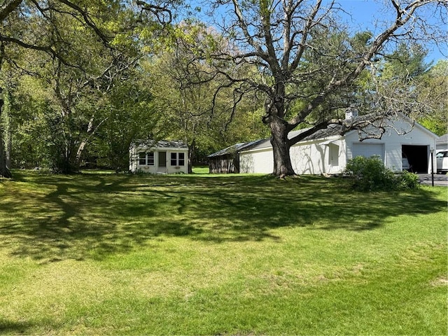 505 Central St, Burrillville, RI 02839 - view of grassy yard with a garage