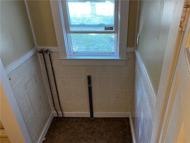 bathroom with tile walls