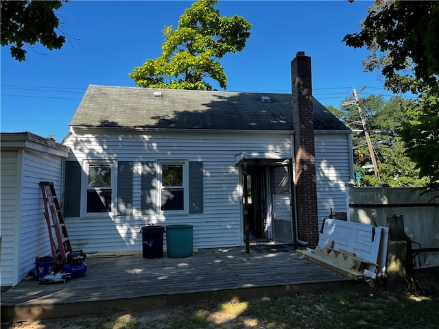 rear view of property with a wooden deck