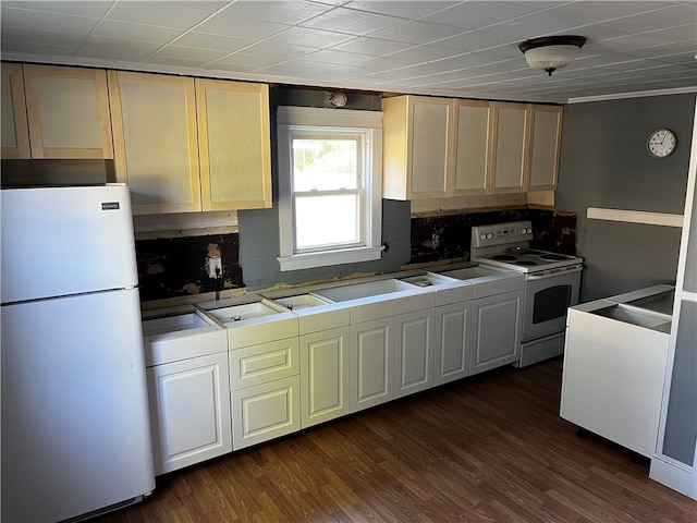 kitchen with white appliances, dark hardwood / wood-style flooring, and decorative backsplash