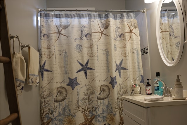 bathroom with vanity and a shower with shower curtain