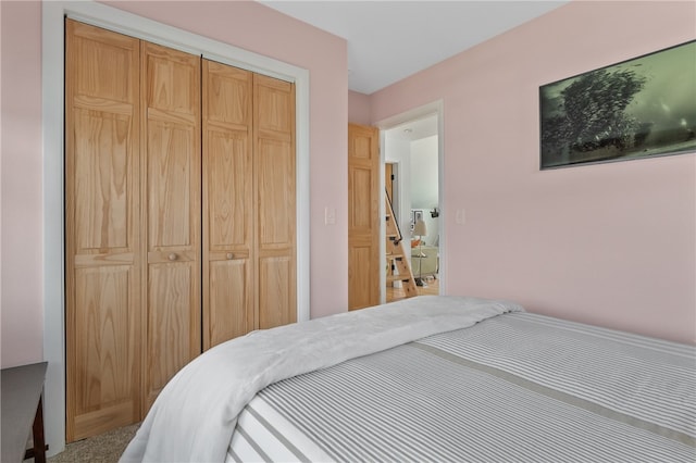 carpeted bedroom with a closet