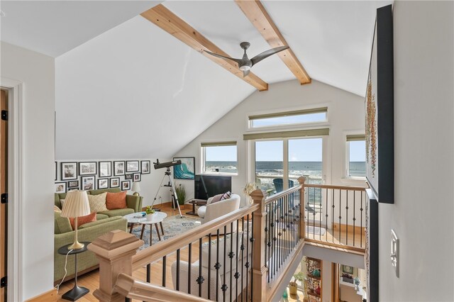 interior space featuring wood-type flooring and vaulted ceiling with beams