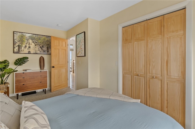 bedroom with carpet and a closet