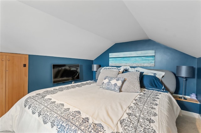 bedroom featuring lofted ceiling